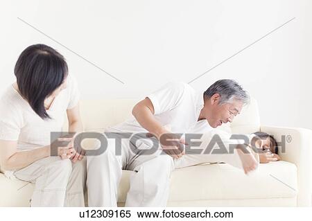Grandparents and Grandson Rough Housing on Sofa View Large Photo Image Stock Photography - Grandparents and Grandson Rough Housing on Sofa. Fotosearch