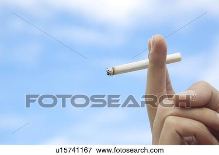 Stock Photo - Hand Holding Cigarette. Fotosearch