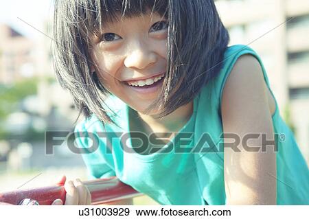 Stock Photo - Happy Girl in Playground. Fotosearch