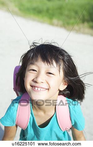 Stock Image - Happy Schoolgirl. Fotosearch
