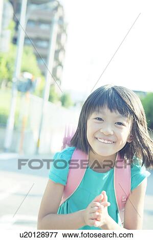 Stock Photo - Happy Schoolgirl. Fotosearch