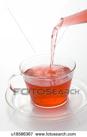 Herbal Tea Being Poured into Cup View Large Photo Image Stock Photo - Herbal Tea Being Poured into Cup. Fotosearch