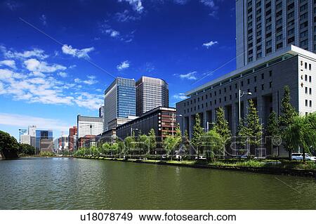 Stock Photo - Hibiya moat and office buildings, Chiyoda Ward, Honshu, Japan. Fotosearch