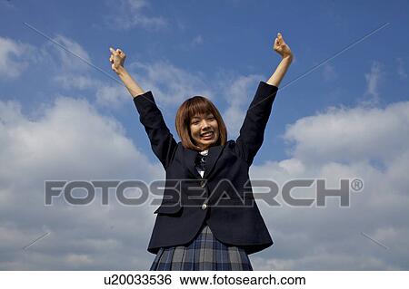 Stock Photograph - High School Student Holding Arms Up. Fotosearch