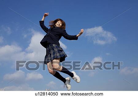 Stock Image - High School Student Jumping. Fotosearch