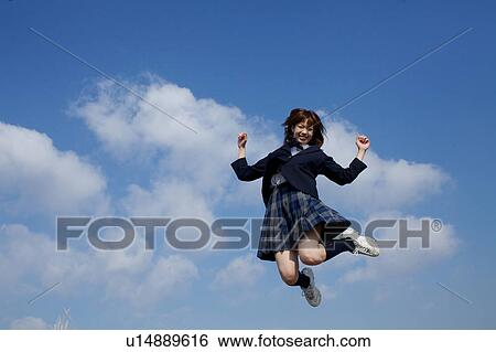 Stock Photograph - High School Student Jumping. Fotosearch