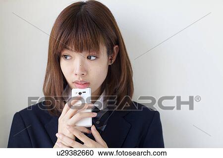 High School Student Listening Music With Mobile Phone View Large Photo Image Stock Image - High School Student Listening Music With Mobile Phone. Fotosearch