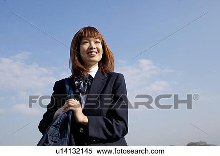 Stock Photography - High School Student Looking up at the sky. Fotosearch