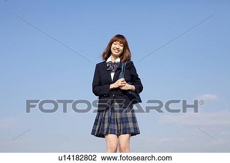High School Student Standing Against Sky View Large Photo Image Stock Image - High School Student Standing Against Sky. Fotosearch
