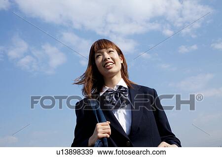 High School Student Standing Against Sky View Large Photo Image Stock Photo - High School Student Standing Against Sky. Fotosearch