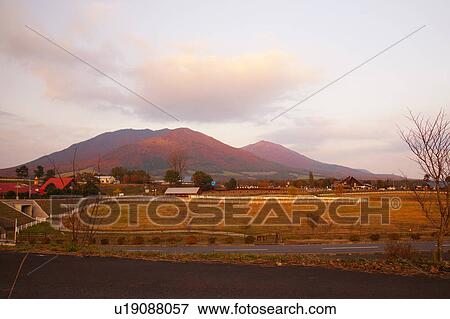 Stock Photo - Hiruzen highland with Mt. Kamihiruzen (left) and Mt. Shiomohiruzen (right), Okayama Prefecture, Honshu, Japan. Fotosearch