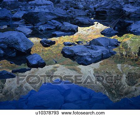Stock Image - Hodaka peaks Reflected on Karasawa Pond. Fotosearch