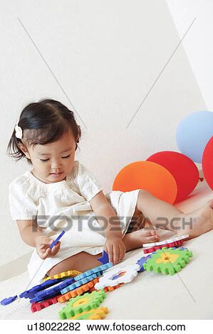 Japanese Baby Girl Playing with Toys View Large Photo Image Stock Image - Japanese Baby Girl Playing with Toys. Fotosearch