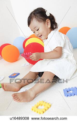 Japanese Baby Girl Playing with Toys View Large Photo Image Stock Photo - Japanese Baby Girl Playing with Toys. Fotosearch