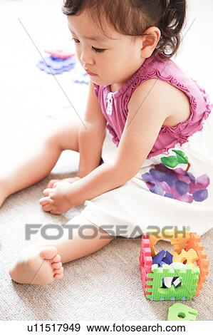 Japanese Baby Sitting on Floor View Large Photo Image Stock Photo - Japanese Baby Sitting on Floor. Fotosearch