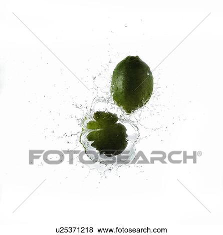 Stock Photo - Limes Splashing into Water. Fotosearch