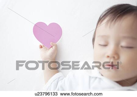 Stock Image - Love Heart in Baby's Hand. Fotosearch
