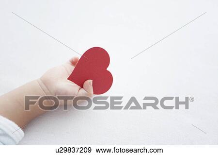 Stock Photo - Love Heart in Baby's Hand. Fotosearch