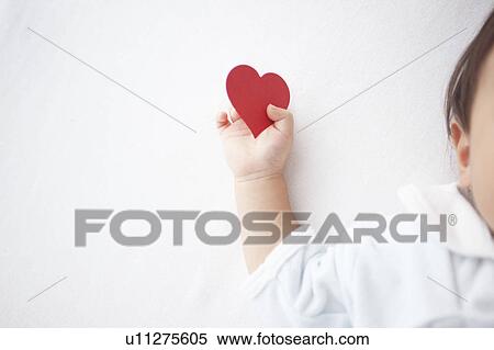 Stock Photography - Love Heart in Baby's Hand. Fotosearch