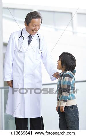 Stock Image - Male Doctor and Boy. Fotosearch