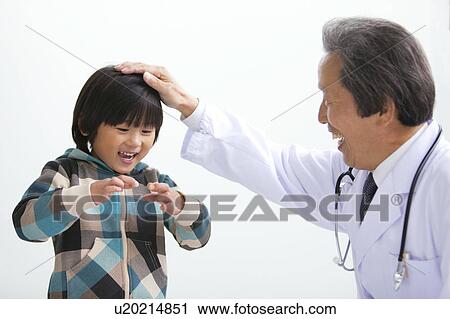Male Doctor and Boy View Large Photo Image Stock Image - Male Doctor and Boy. Fotosearch