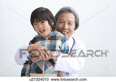 Male Doctor and Boy View Large Photo Image Stock Image - Male Doctor and Boy. Fotosearch