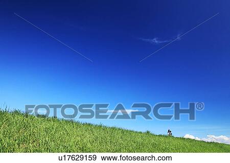 Stock Photo - Man cycling, Ibaraki Prefecture, Honshu, Japan. Fotosearch