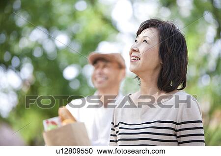Mature couple after grocery shopping View Large Photo Image Stock Image - Mature couple after grocery shopping. Fotosearch