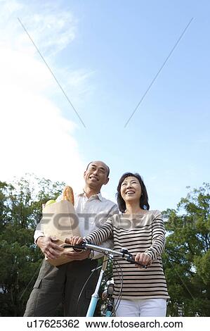 Mature couple after grocery shopping View Large Photo Image Stock Image - Mature couple after grocery shopping. Fotosearch