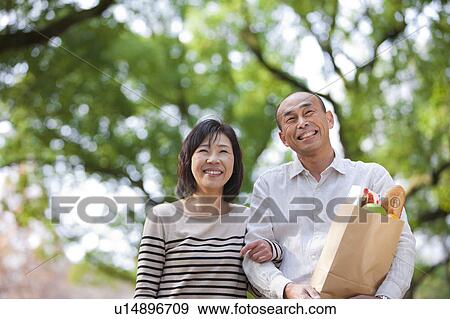 Mature couple after grocery shopping View Large Photo Image Stock Photo - Mature couple after grocery shopping. Fotosearch