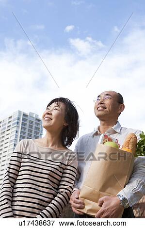 Mature couple after grocery shopping View Large Photo Image Stock Photo - Mature couple after grocery shopping. Fotosearch
