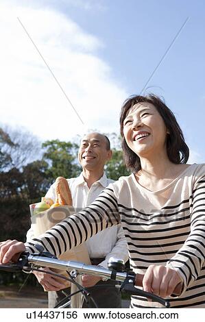 Mature couple after grocery shopping View Large Photo Image Stock Photograph - Mature couple after grocery shopping. Fotosearch