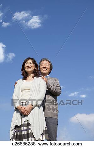 Mature Couple Against Blue Sky View Large Photo Image Stock Photo - Mature Couple Against Blue Sky. Fotosearch