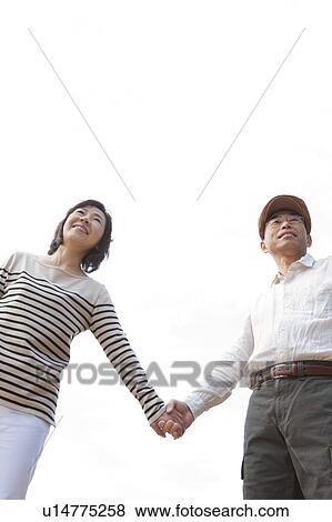 Mature couple holding hands View Large Photo Image Stock Photo - Mature couple holding hands. Fotosearch