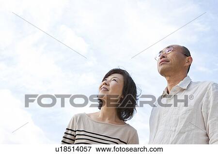 Mature couple looking up View Large Photo Image Stock Photo - Mature couple looking up. Fotosearch