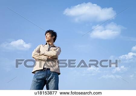 Mid Adult Man Against Sky View Large Photo Image Stock Photo - Mid Adult Man Against Sky. Fotosearch