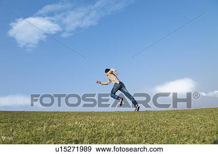 Stock Photo - Mid Adult Man Running. Fotosearch