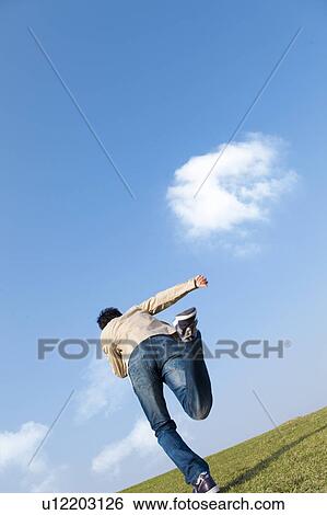 Stock Photograph - Mid Adult Man Running. Fotosearch