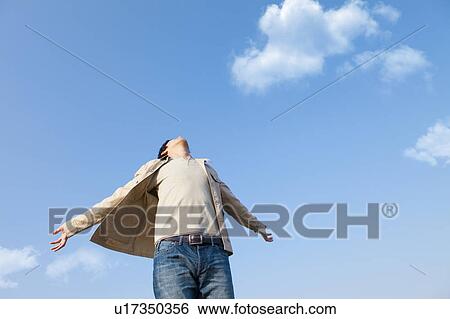 Mid Adult Man with Arms Outstretched View Large Photo Image Stock Photograph - Mid Adult Man with Arms Outstretched. Fotosearch