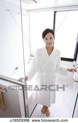 Stock Photo - Mid Adult Woman in Bathroom. Fotosearch