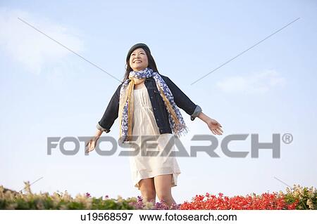 Mid Adult Woman in Field with Outstretched View Large Photo Image Stock Photo - Mid Adult Woman in Field with Outstretched. Fotosearch