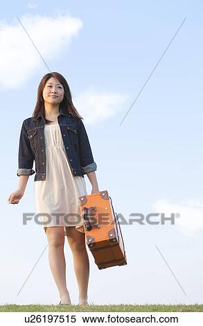 Stock Photography - Mid Adult Woman Traveling. Fotosearch
