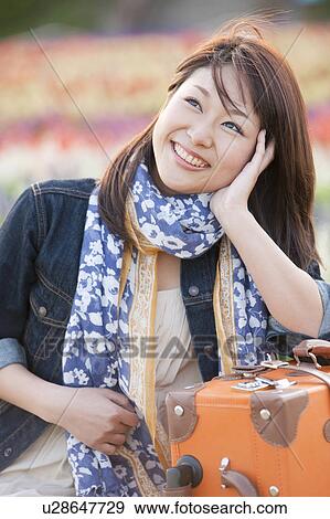 Stock Photo - Mid Adult Woman Travelling. Fotosearch