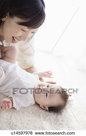 Mother and baby looking at each other View Large Photo Image Stock Photo - Mother and baby looking at each other. Fotosearch