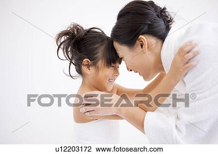 Stock Image - Mother and daughter face to face. Fotosearch