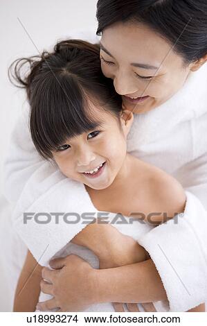 Picture - Mother Embracing daughter. Fotosearch