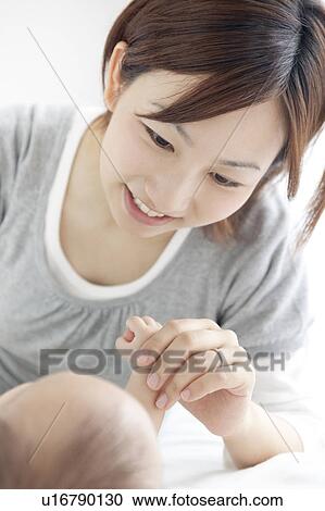 Mother Holding Baby Girl's Hand View Large Photo Image Stock Image - Mother Holding Baby Girl's Hand. Fotosearch