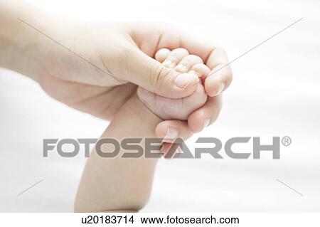 Picture - Mother Holding Baby's Hand. Fotosearch