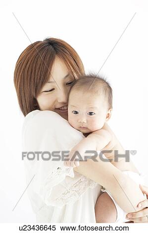 Stock Photography - Mother Holding Newborn Baby. Fotosearch