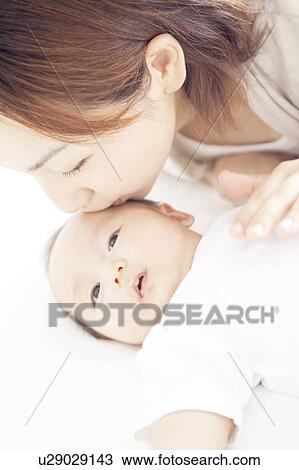 Mother Kissing Newborn Baby View Large Photo Image Stock Image - Mother Kissing Newborn Baby. Fotosearch